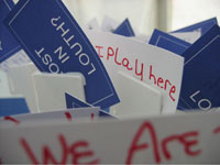 cake with business cards featuring comments by event participants